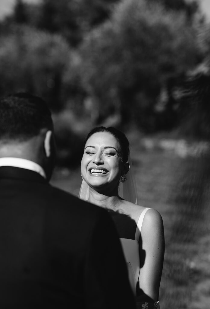Newlyweds embracing in a black-and-white wedding portrait
