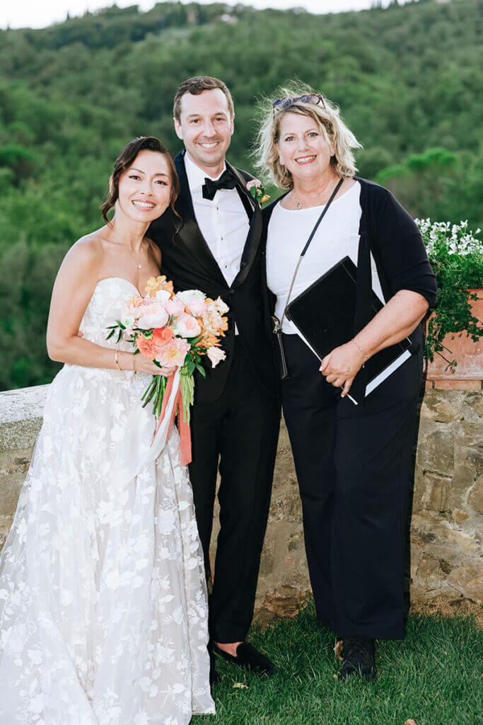 Wedding officiant Elizabeth standing with newlyweds after their ceremony