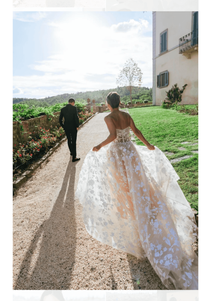 Bride walking with a companion through the garden of an Italian villa