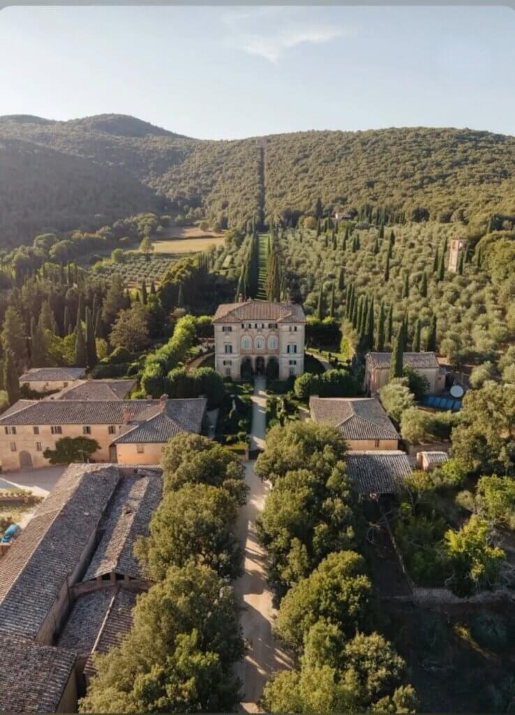 Historic villa surrounded by cypress trees in the Tuscan countryside